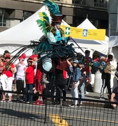 Another stilt walker in a bird rider costume